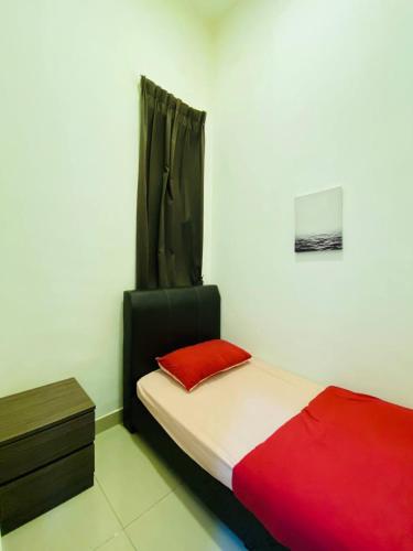 a bedroom with a bed with a red pillow at Home Garden - Palas Horizon, Brinchang Cameron Highlands in Cameron Highlands