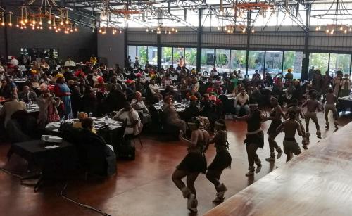 a group of dancers performing in front of a crowd at Safari Hotel & Convention Centre in Rustenburg