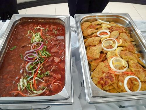 two trays of food on a table with chili at Safari Hotel & Convention Centre in Rustenburg