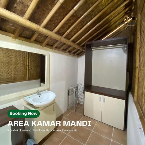 a bathroom with a sink and a toilet at Bamboo Sanctuary Pancawati Resort Bogor in Ciherangsating