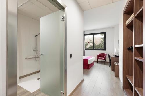 a bathroom with a shower and a bedroom at Hotel Best 4 Barcelona in Barcelona