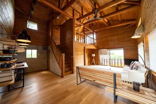 a large room with wooden walls and wooden floors at Cottage Coliberty - Vacation STAY 60563v in Anan