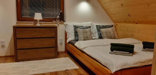 Postel nebo postele na pokoji v ubytování Domek Elza