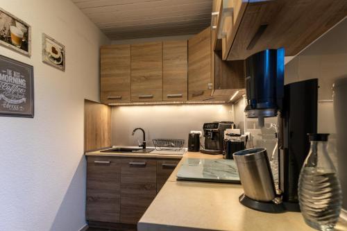 a kitchen with a counter with a coffee maker at Ferienwohnung Haus am See in Kaufungen