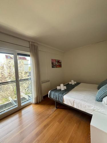 Postel nebo postele na pokoji v ubytování Ulia Apartments- Garden Boutique