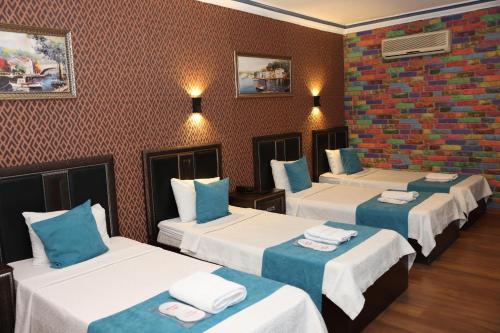 Postel nebo postele na pokoji v ubytování Adana Saray Hotel