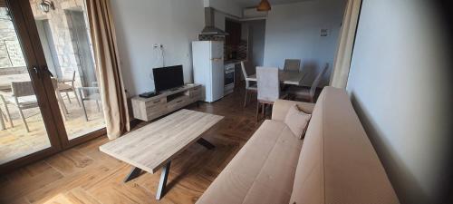 a living room with a couch and a table at Villa Molivos Castle in Mithymna