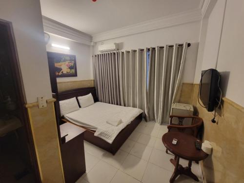 En eller flere senger på et rom på Golden Hotel