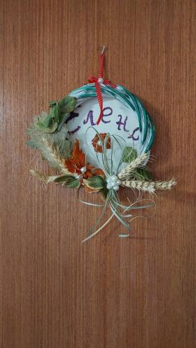 a christmas ornament on a table with the word hi at Аpartman ELENA in Rakovac