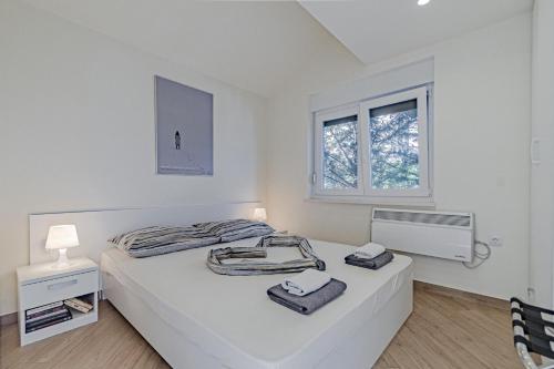 Un pat sau paturi într-o cameră la Apartment Vila Inga