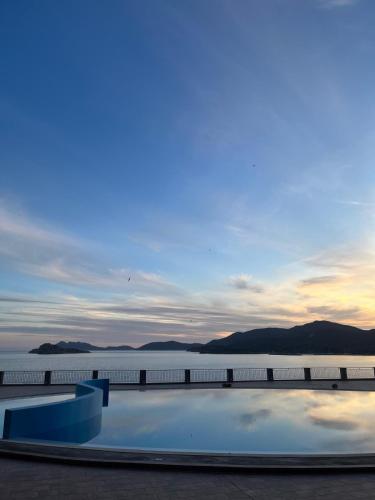 a pool on the roof of a building with the water at Ste.Mar Apartments in Teulada