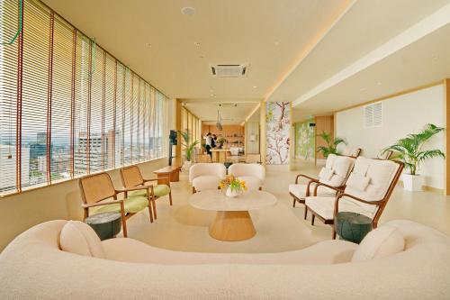 a hospital waiting room with chairs and a table at Cititel Express Ipoh in Ipoh