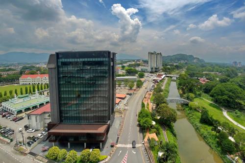 an aerial view of a city with a tall building at Cititel Express Ipoh in Ipoh