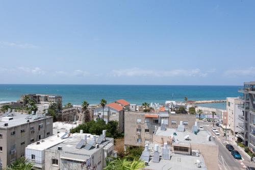 an aerial view of a city and the ocean at PORT CITY HAIFA - Luxury Seaview Penthouse w Jaccuzzi in Haifa