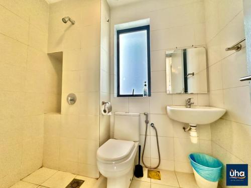 a bathroom with a toilet and a sink at 1 Tebrau Residences By RR JBcity in Johor Bahru