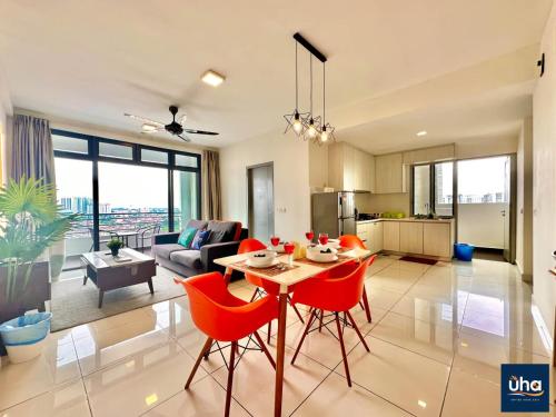 a kitchen and living room with a table and chairs at 1 Tebrau Residences By RR JBcity in Johor Bahru