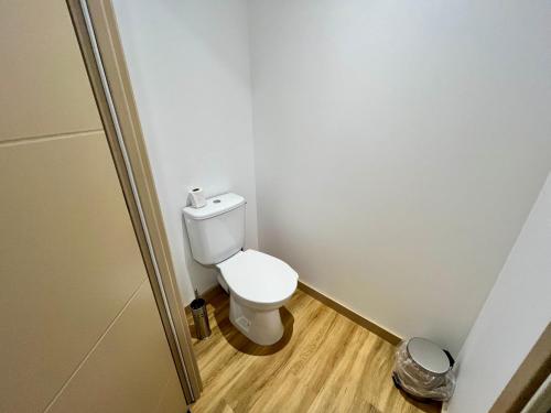a small bathroom with a toilet in a room at Le Parmé' Nid - gîte avec terrasse in Beaucroissant