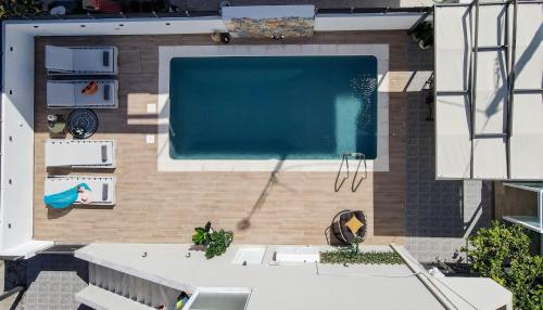 an overhead view of a swimming pool in a building at Grande Terra in Kiotari