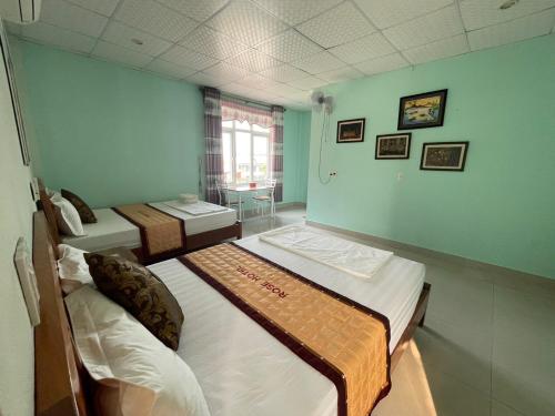 Ένα ή περισσότερα κρεβάτια σε δωμάτιο στο Bee Backpackers Hostel