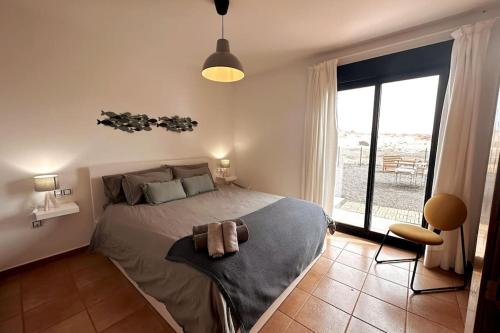 Postel nebo postele na pokoji v ubytování Mejores vistas de Fuerteventura