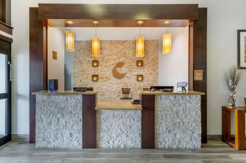 a lobby of a hotel with a reception counter at Comfort Inn & Suites FM1960-Champions in Houston