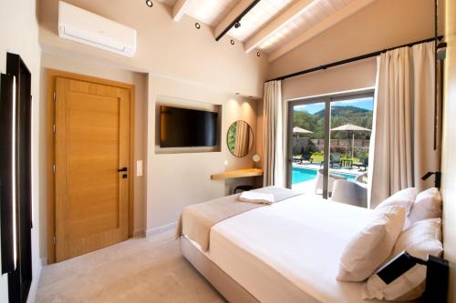 Ένα ή περισσότερα κρεβάτια σε δωμάτιο στο Villa Masticha Sweet by Villa Plus