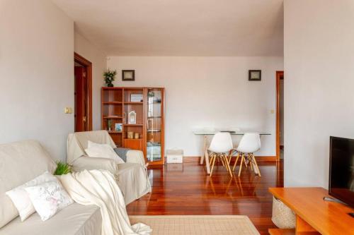 a living room with a couch and a table at BILBAO COSTA VASCA apartamento entero 3 Dormitorios 4 camas WIFI 5G in Leioa