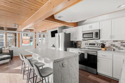 a kitchen with white cabinets and a counter top at 803 E, Durant Le Clairvaux #5 condo in Aspen