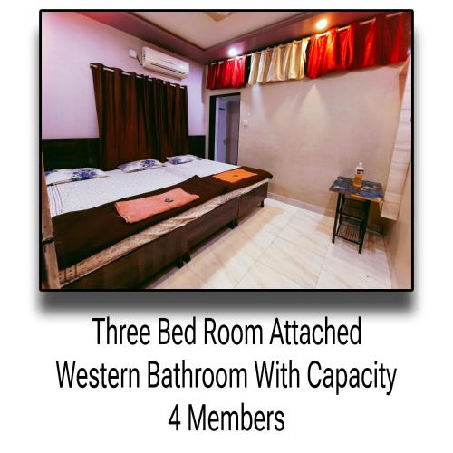 a three bed room at a western bathroom with capacity four members at Palange Bhakt Niwas in Tuljapur