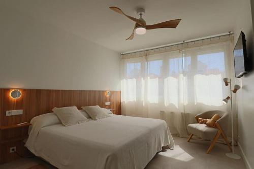 Ένα ή περισσότερα κρεβάτια σε δωμάτιο στο Adosado Familiar Los Enebros