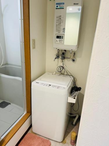 札幌市にあるVivere南5条のバスルーム(洗濯機、乾燥機、バスタブ付)