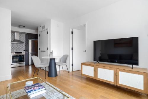 A television and/or entertainment centre at East Village 2br w doorman nr Union Square NYC-1155