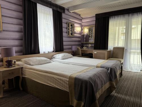 A bed or beds in a room at VitaPark Carpaty
