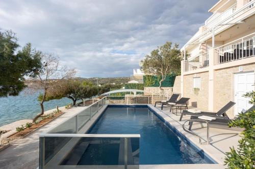 Villa Sea Touch - beachfront, with a heated pool