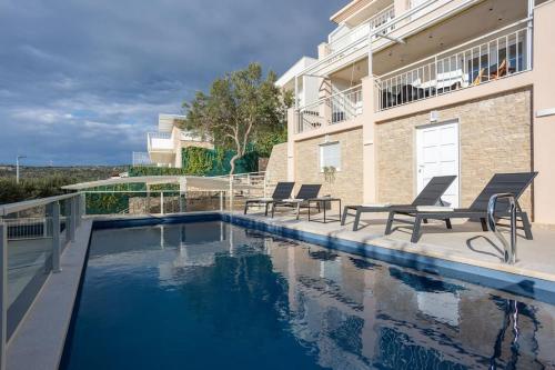 Villa Sea Touch - beachfront, with a heated pool