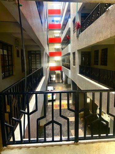 an empty hallway of a building with stairs and chairs at Thika Furnished Apartments in Thika