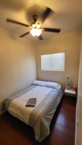 a bedroom with a ceiling fan and a bed at Unit 1 - Modern Roosevelt Row Condo 2BR 1BA Downtown Stay in Phoenix