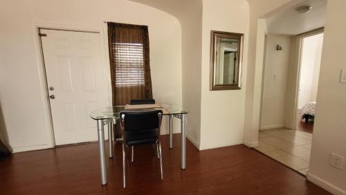 a glass table with a laptop on it in a room at U1 - Entire 2 BR Pet Friendly APT in DT PHX with pkg in Phoenix