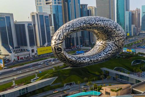 a large sculpture in the middle of a city at Jumeirah Emirates Towers Dubai in Dubai