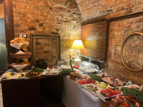 a buffet of food on a counter in a room at Apartament Baron II ***** in Jelenia Góra