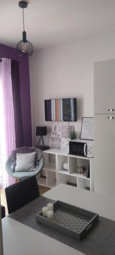 a living room with a computer keyboard on a table at Tomena apartments in Trogir