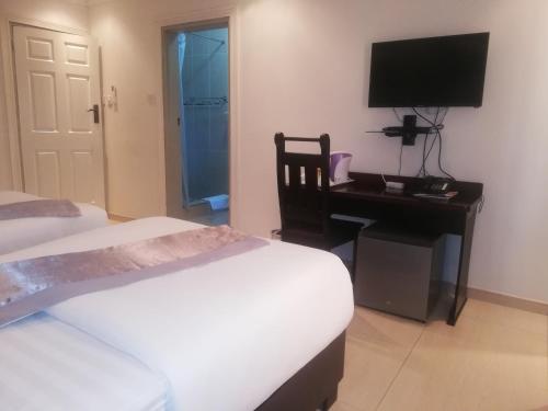 The Tamek Palace Hotelにあるベッド