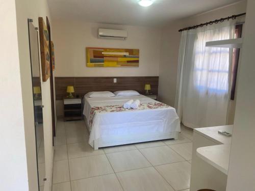 Katil atau katil-katil dalam bilik di Hotel Pousada Salvador Paradise