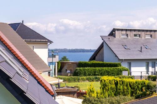 a view of the water from the roofs of houses at Ferienwohnung Johanna OG in Wohlenberg