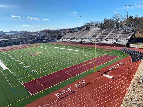 a stadium with a football field and a track at Marvelous Modern apartment at perfect location in Mount Vernon
