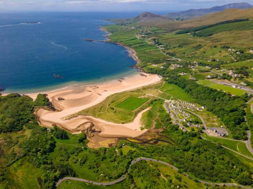 an aerial view of a beach and the ocean at Kilcar Lodge in Kilcar