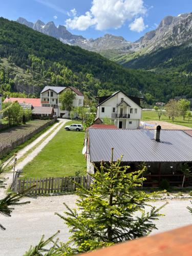 a view of a village with mountains in the background at Guesthouse Skender Selimaj in Valbonë