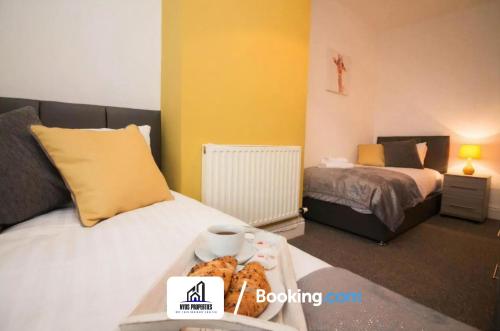 a bedroom with two beds and a tray of food on a bed at Modern 3 bed Terraced House By NYOS PROPERTIES Short Lets & Serviced Accommodation Manchester With Free WiFi in Manchester