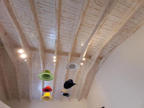 a ceiling with several different colored lights on it at Villa Don Kostangelo in Nikiana