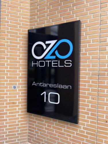 a sign on the side of a building at OZO Hotels Antares Airport in Hoofddorp